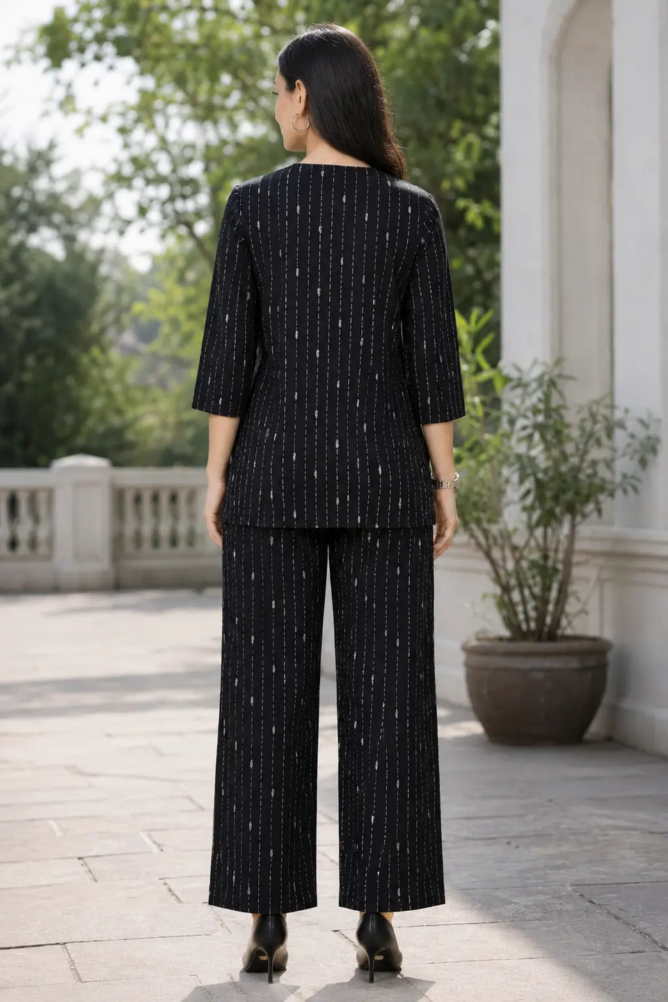 Back view of Rabric black cotton short co-ord set for women with white vertical dashed stripe print and wide pajama pants