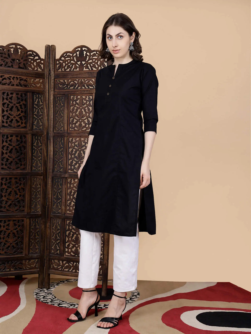 Close-up of round neck with brass buttons and thread work design