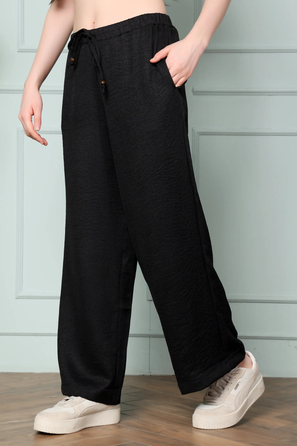 RABRIC black linen wide leg pants for women side view showing relaxed fit and side pocket