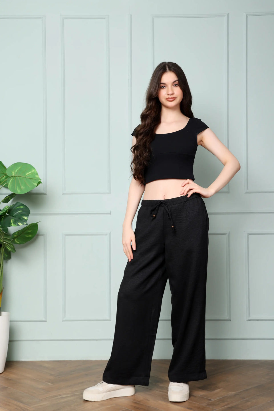 RABRIC black linen wide leg trousers for women standing front view with elastic drawstring waist