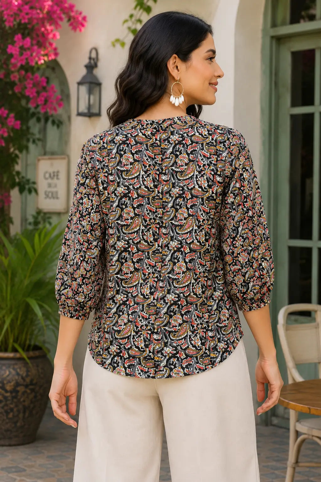 Back view of Rabric black multicolor paisley print cotton short top for women with relaxed fit and 3-4 elastic sleeves