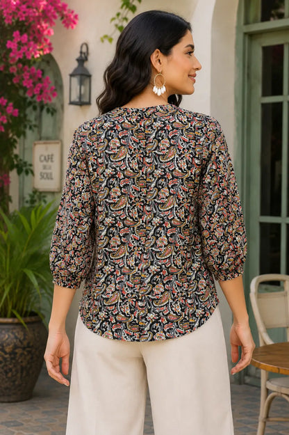 Back view of Rabric black multicolor paisley print cotton short top for women with relaxed fit and 3-4 elastic sleeves