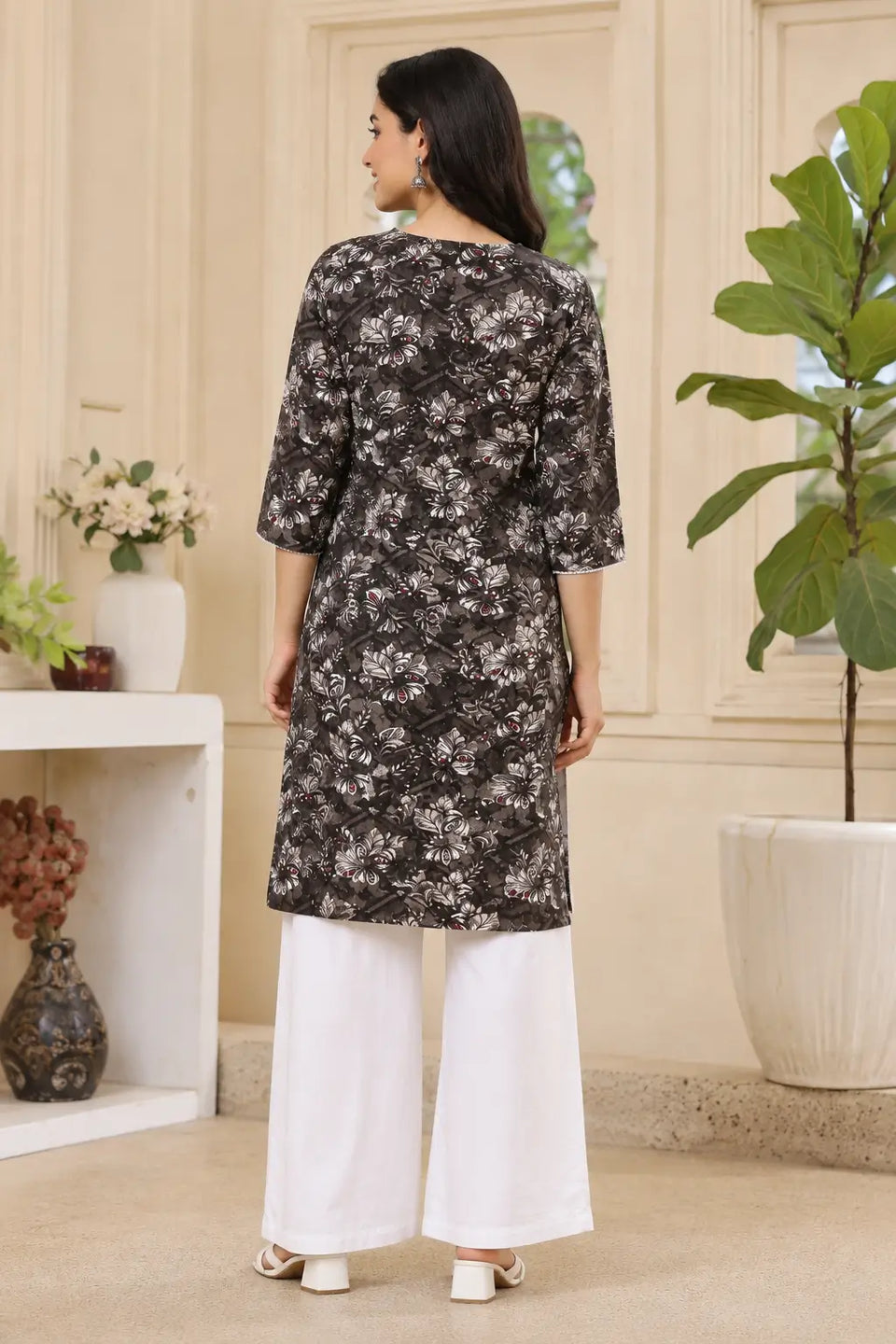 Back view of Rabric black floral printed cotton kurti for women with elegant straight fit and 3-4 sleeves ethnic wear