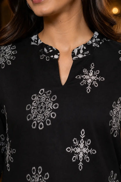 Close up neck design of Rabric black Vertican Silk co-ord set with mandarin neckline and white floral print detailing