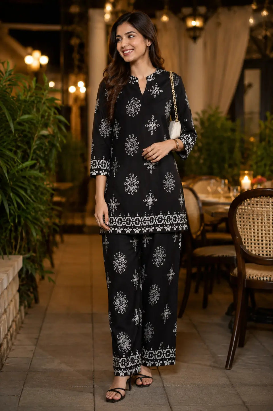 Rabric black Vertican Silk women co-ord set with white floral and geometric print, short kurta with 3/4 sleeves and matching wide leg pants front view