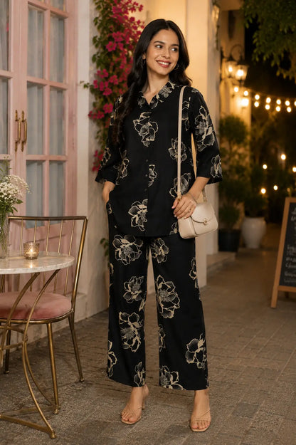 Rabric black Vertican Silk floral print women co-ord set styled for evening date look with casual accessories