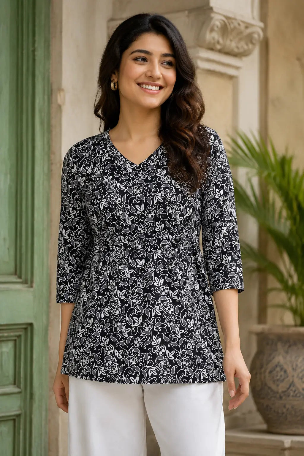 Rabric black white cotton cambric floral short top for women front view with V neck and 3-4 sleeves casual stylish tunic top