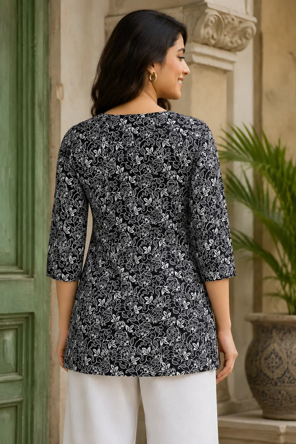 Back view of Rabric black white cotton cambric floral short top for women with 3-4 sleeves and relaxed stylish fit