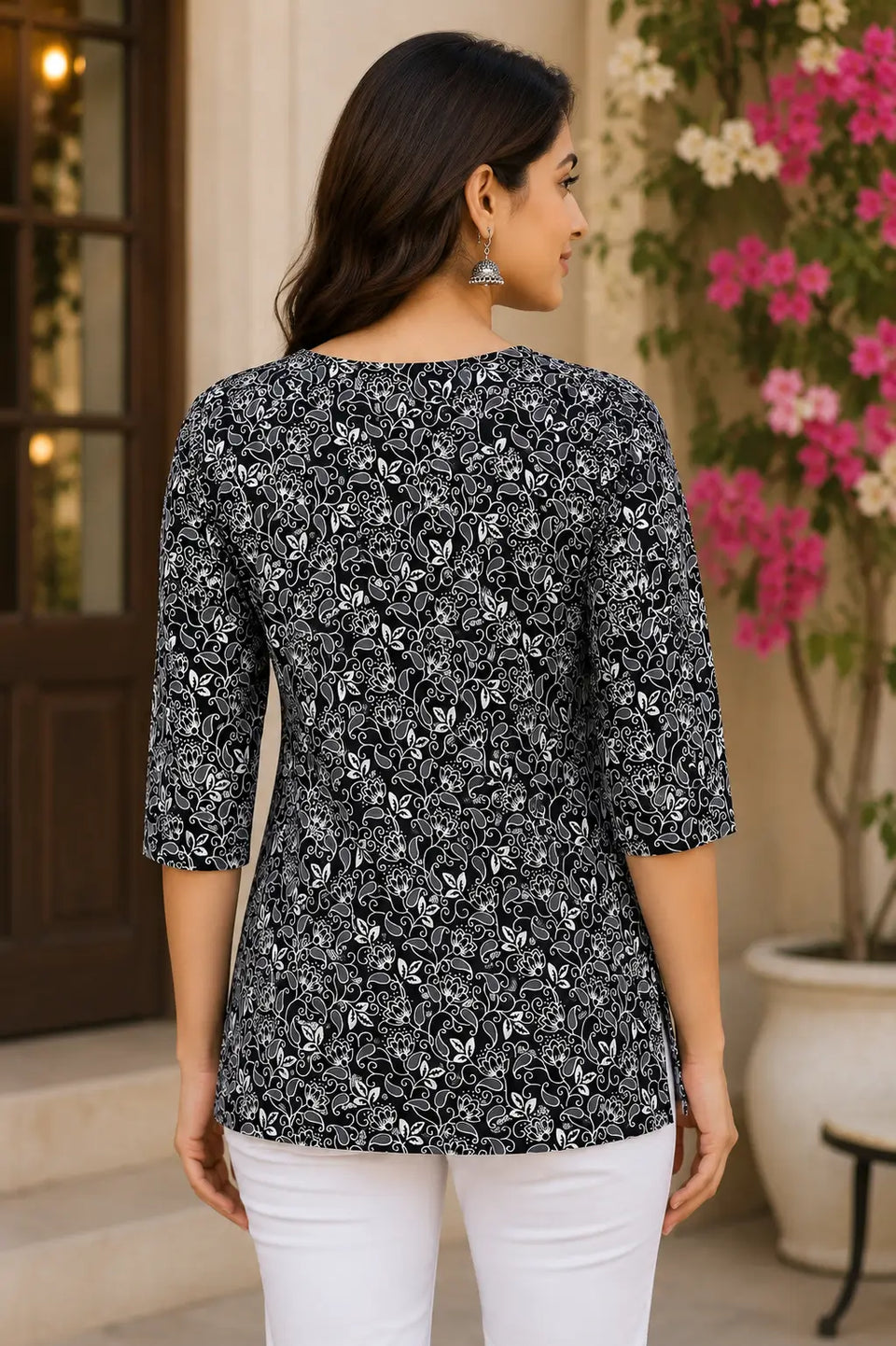 Back view of Rabric black white floral printed cotton tunic top for women with 3/4 sleeves and comfortable mid length fit