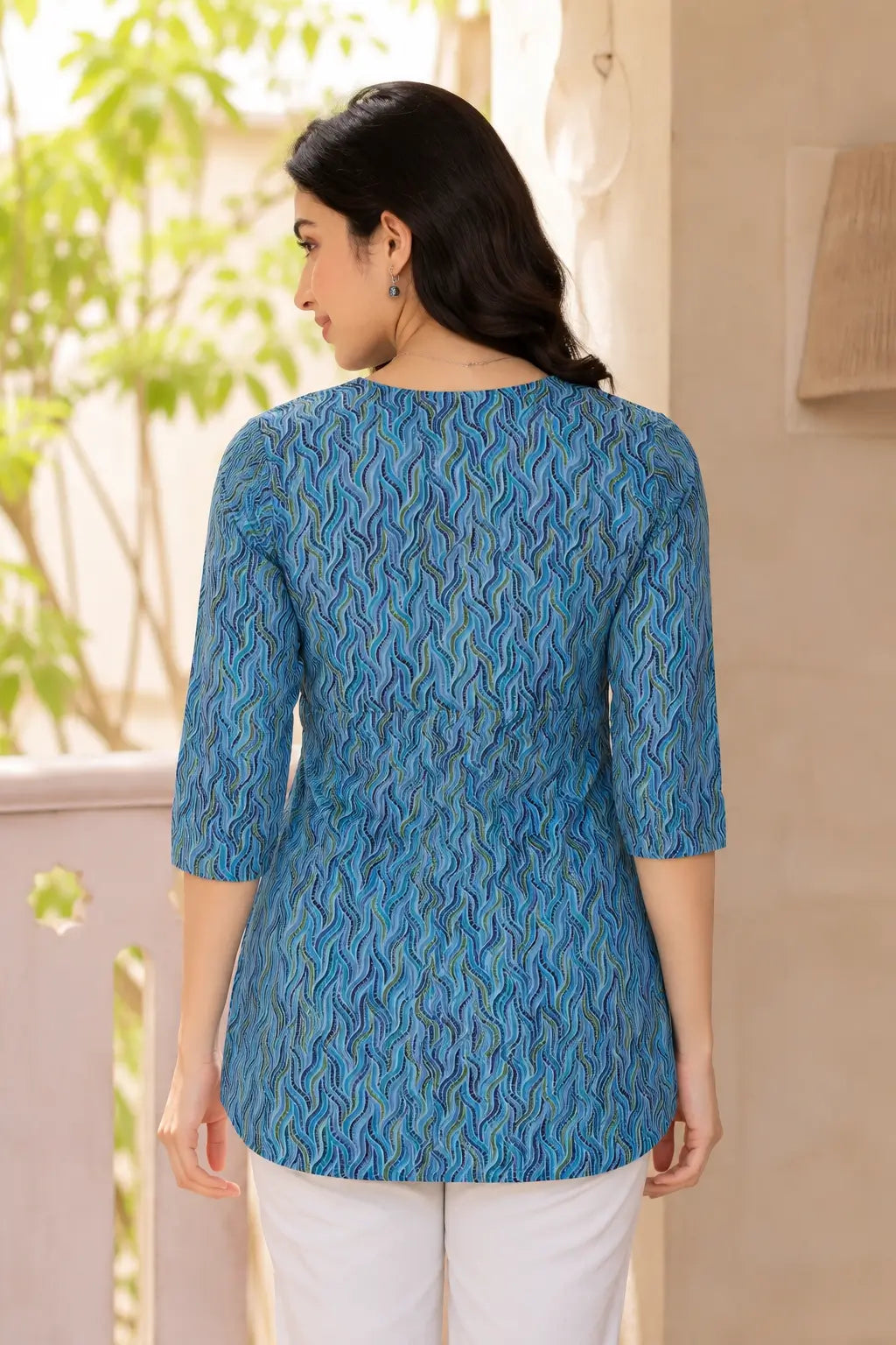 Back view of Rabric blue cambric cotton short top for women with 3/4 sleeves and straight hem casual ethnic western wear