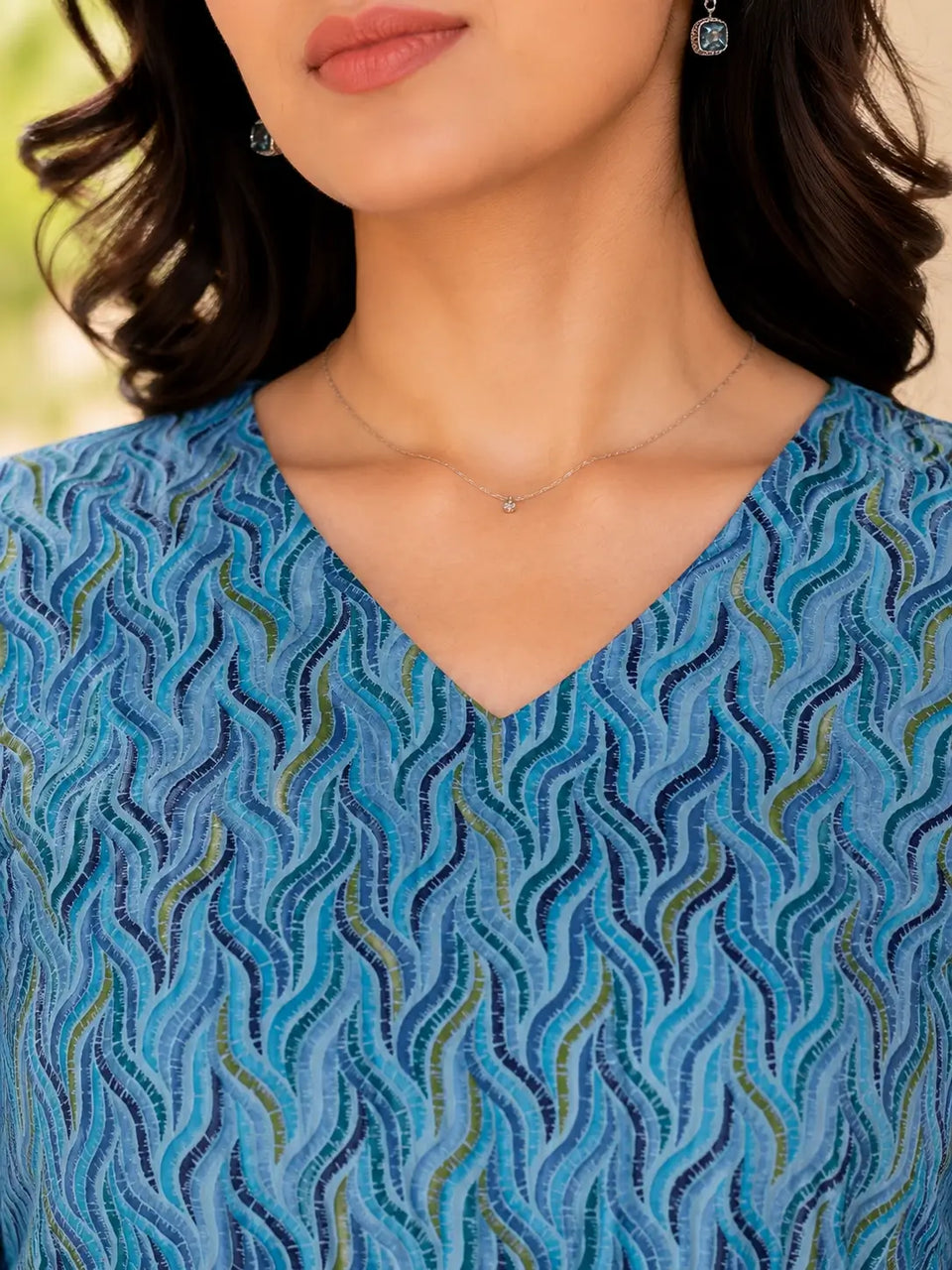 Close up V neck design detail of Rabric blue cambric cotton women short top with soft breathable cotton fabric
