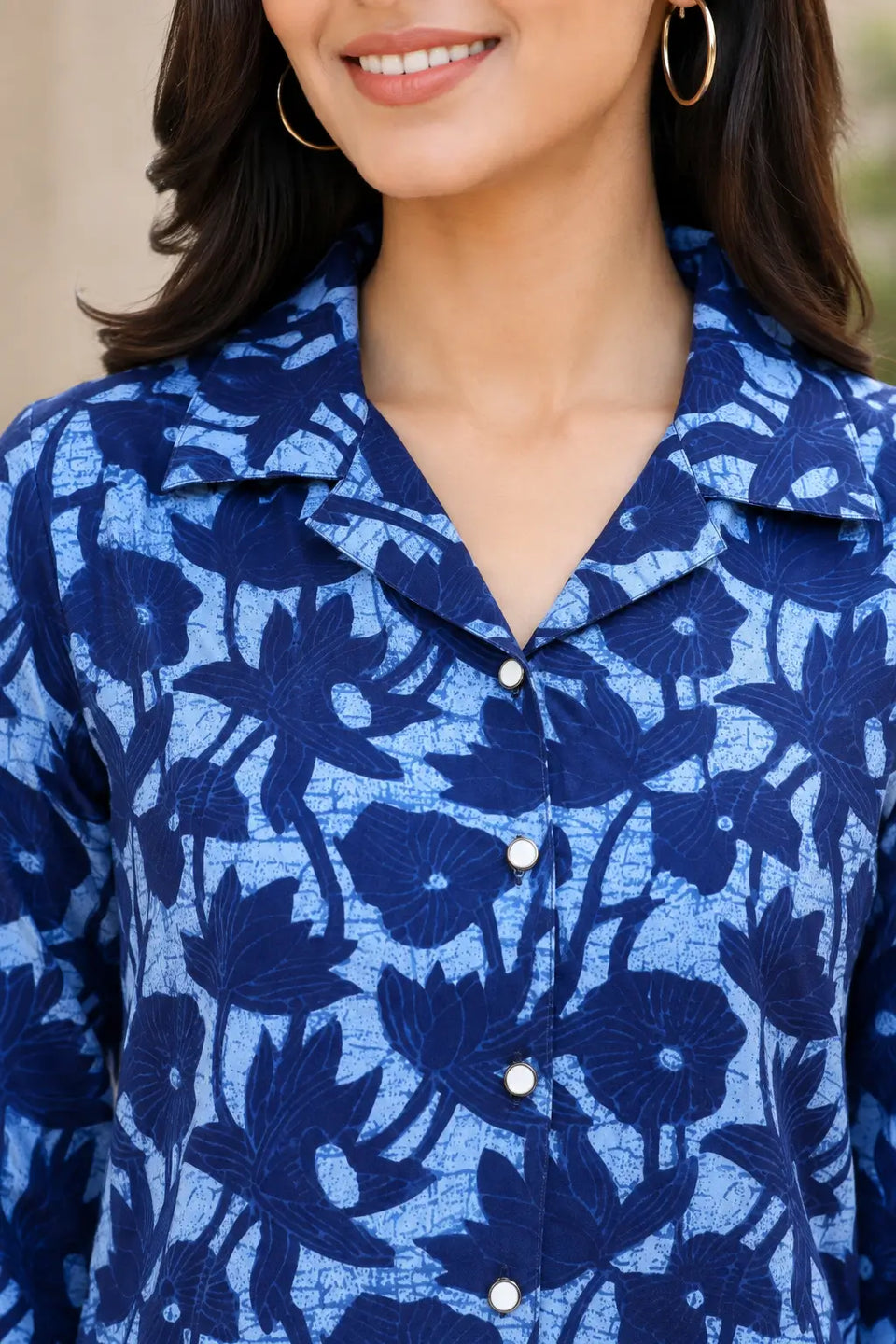 Close-up of Rabric blue cotton floral printed kurti with stylish collared neck and functional operational front buttons