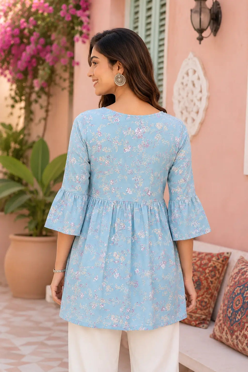 Back side design of women blue floral cotton short kurti with flare fit and 3/4 sleeves by Rabric