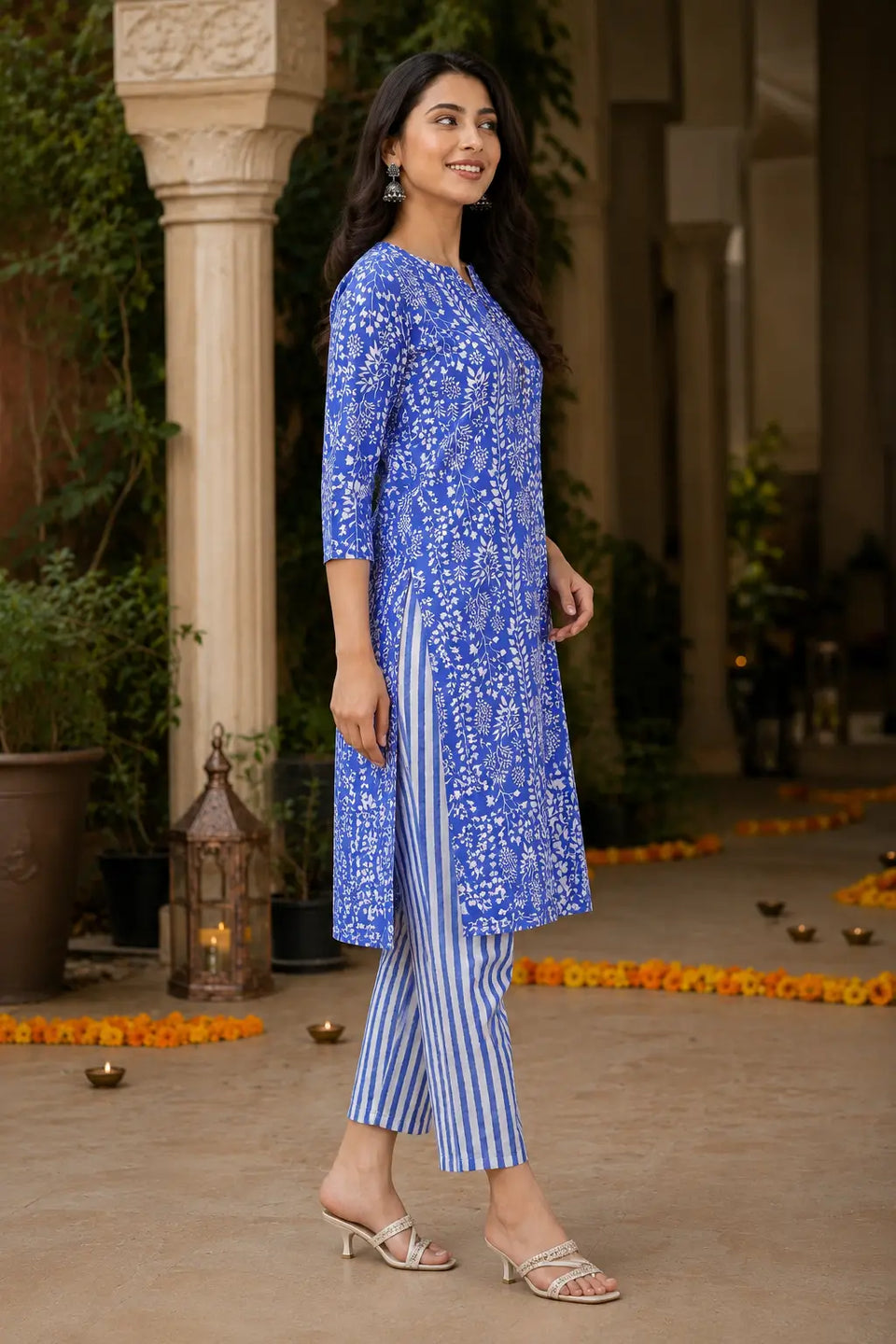 Side angle view of Rabric blue floral cotton kurta pant set with straight fit striped pants for casual ethnic fashion