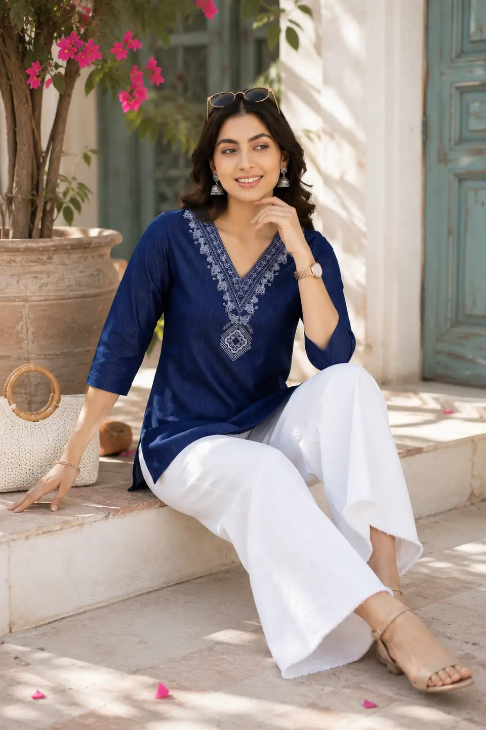 Rabric blue cotton embroidered short top for women in casual sitting lifestyle pose with elegant accessories