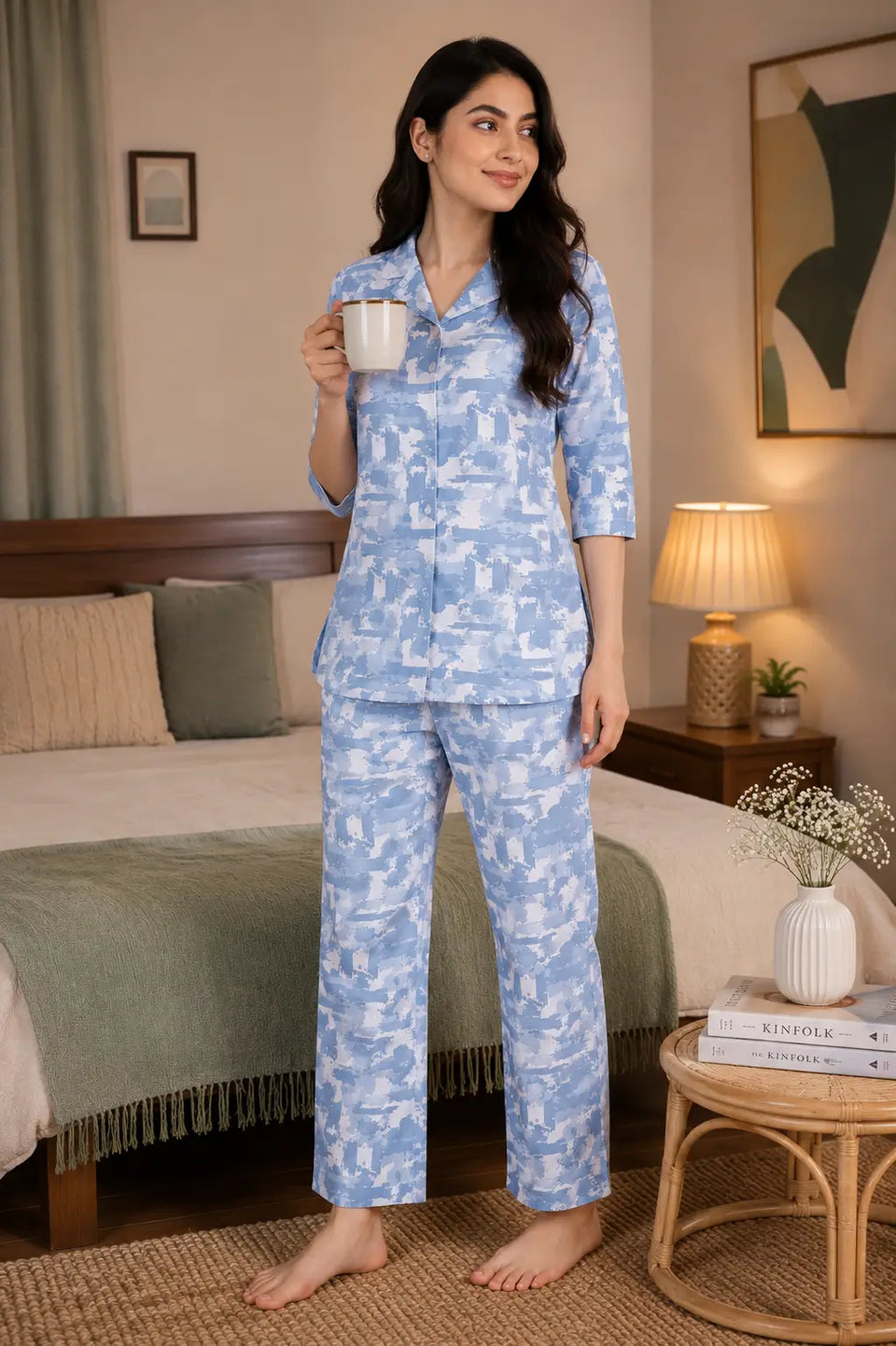 Rabric luxury blue glace cotton women’s nightwear co-ord set lifestyle image in cozy bedroom setting