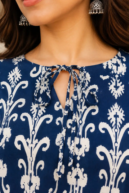 Close-up of RABRIC blue floral printed top with tie-up keyhole neckline for women