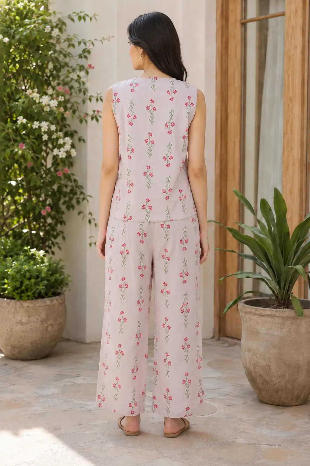 Back view of Rabric blush pink Cotton Flex women co-ord set featuring a sleeveless short top, wide-leg pajama and delicate pink floral green stem print