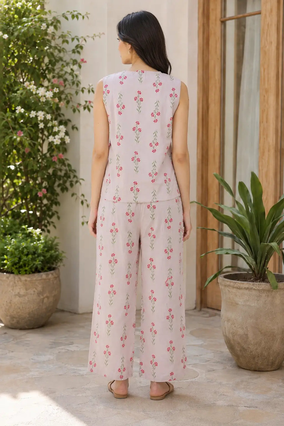 Back view of Rabric blush pink Cotton Flex women co-ord set featuring a sleeveless short top, wide-leg pajama and delicate pink floral green stem print