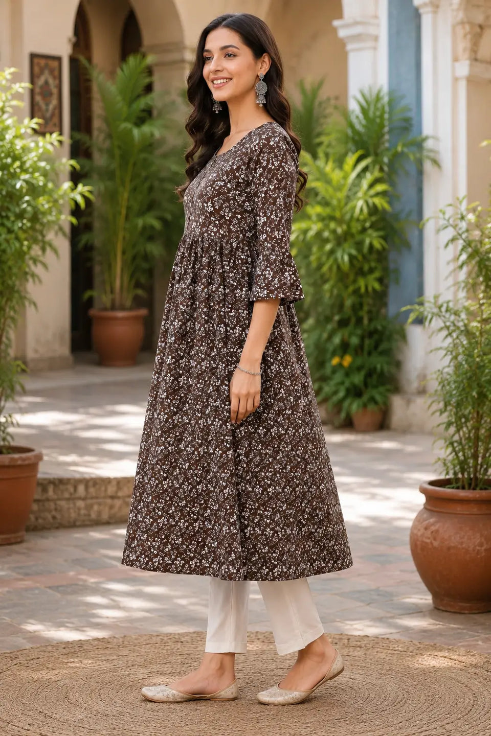 Side angle view of Rabric brown floral crepe A-line kurti for women with elegant flare and casual ethnic styling
