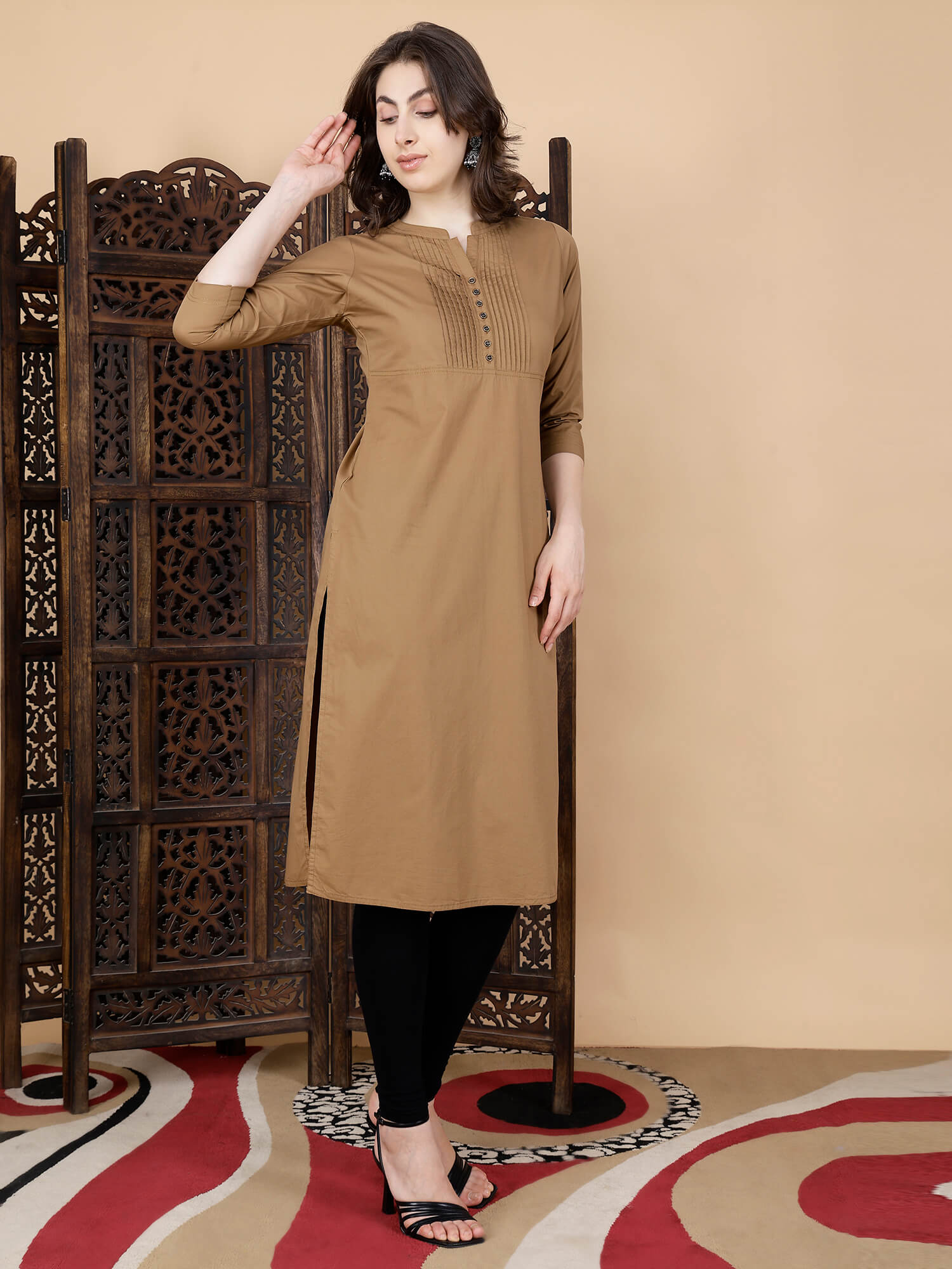 Women styling brown long kurti from Rabric with leggings