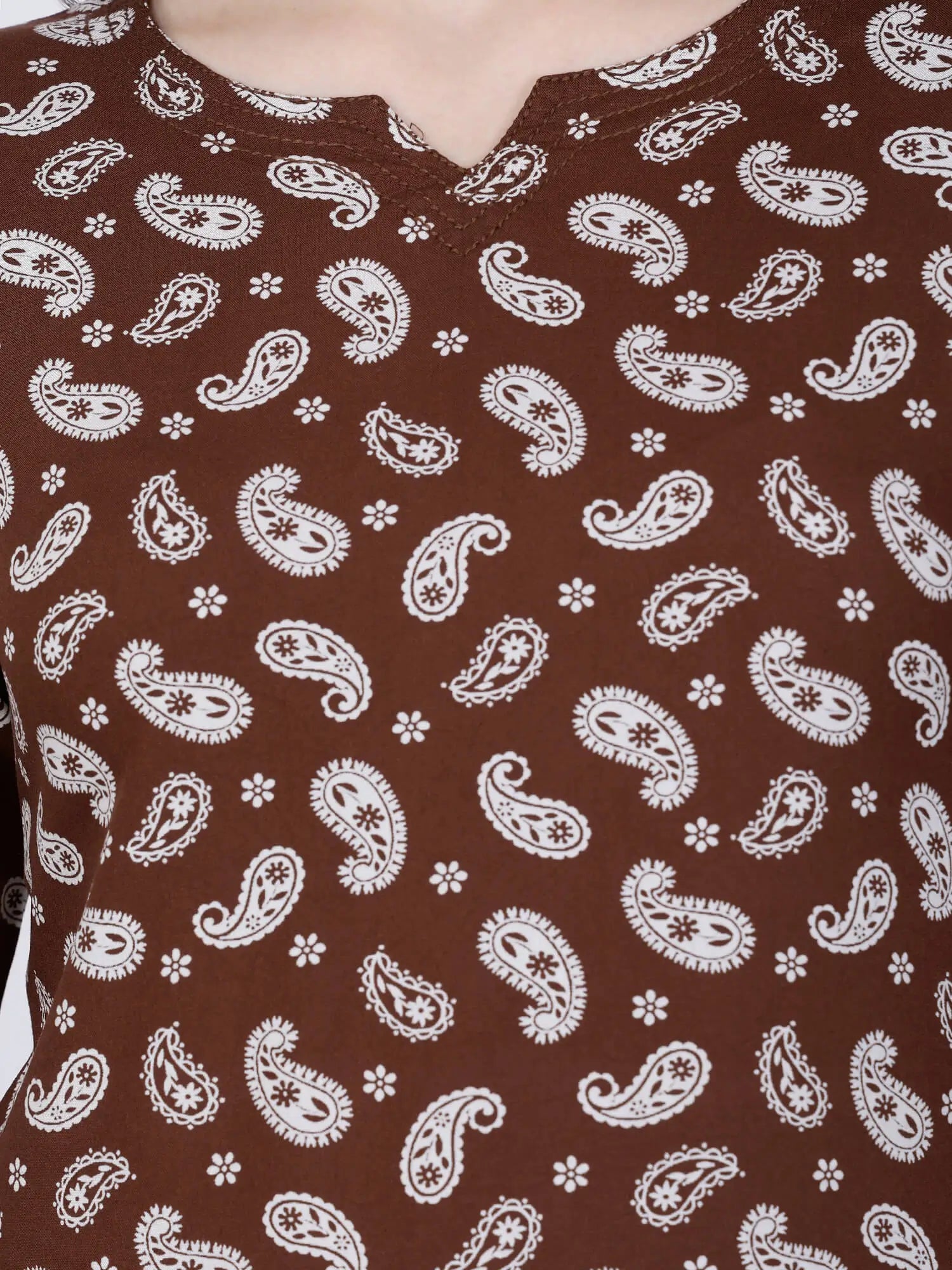 Close-up of White Paisley Print on Brown Rayon Top