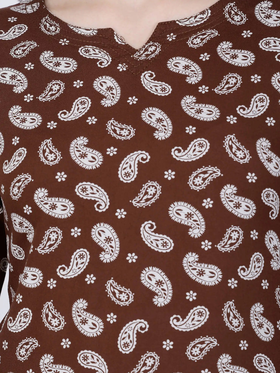 Close-up of White Paisley Print on Brown Rayon Top