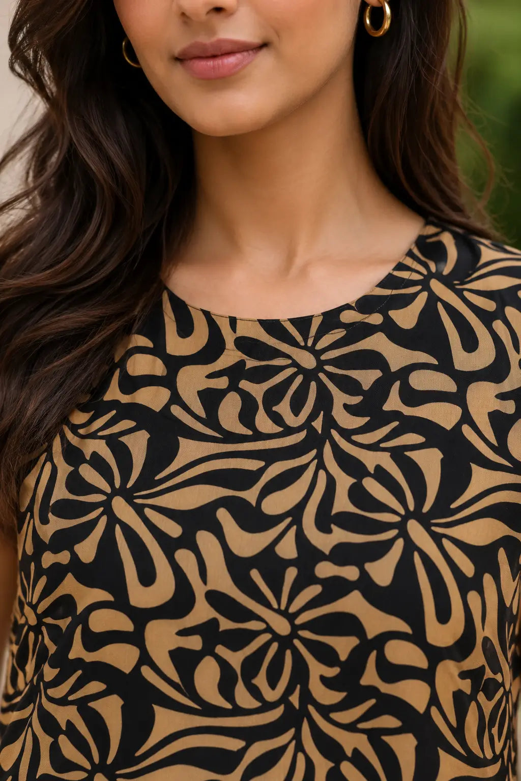 Close-up of Rabric camel beige and black Rayon abstract floral print sleeveless co-ord set with round neck design for women