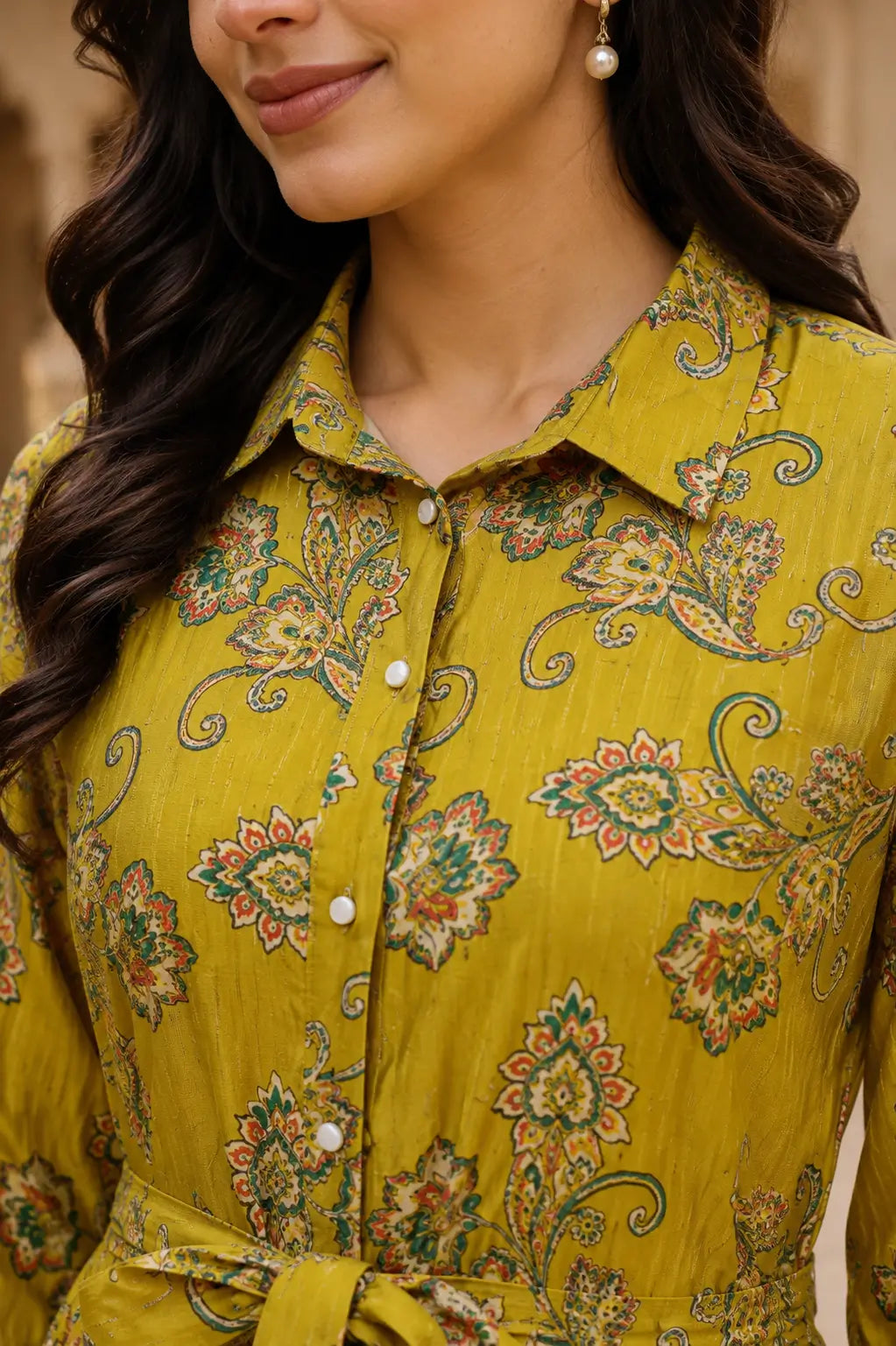 Close-up of collared neck and button detail on parrot green co-ord set