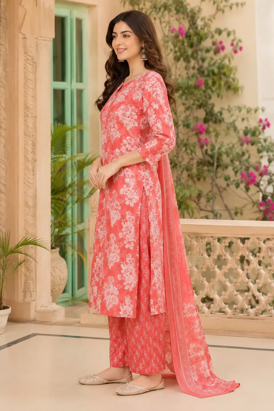 Side angle view of Rabric coral pink cotton floral kurta pant set with dupatta and 3/4 sleeves for women