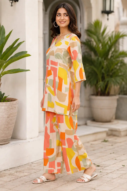 Side angle view of Rabric cotton co-ord set for women in cream beige color with multicolor abstract geometric print and wide leg pants