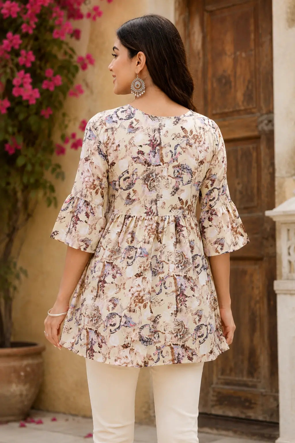Back side view of women cotton flared short kurti top with abstract print and 3/4 sleeves by Rabric