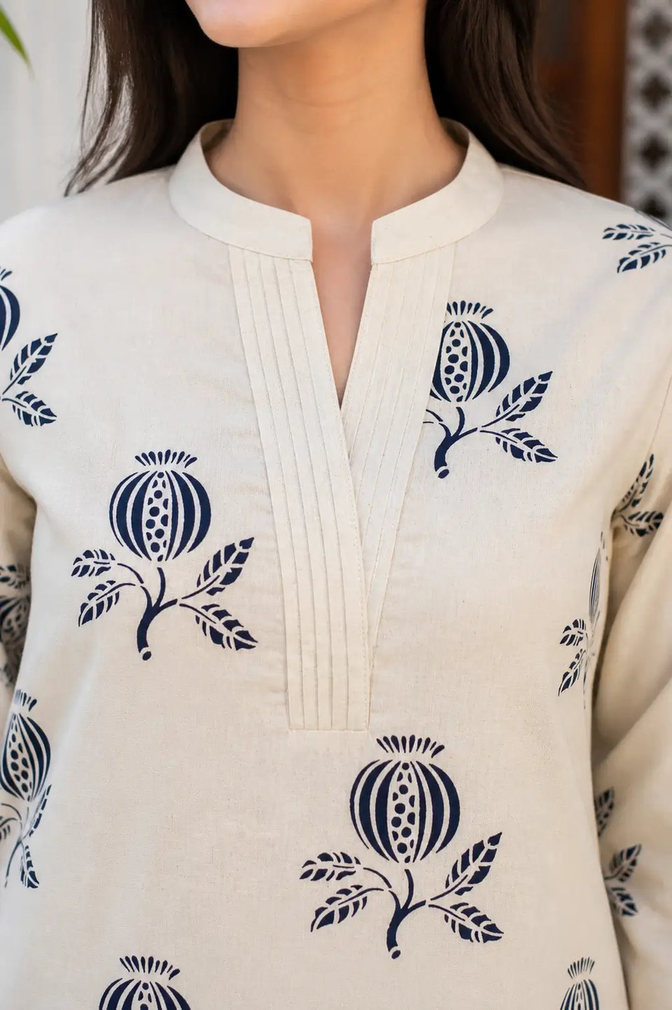 Close-up of V-neck pintuck design on Rabric beige cotton flex kurta