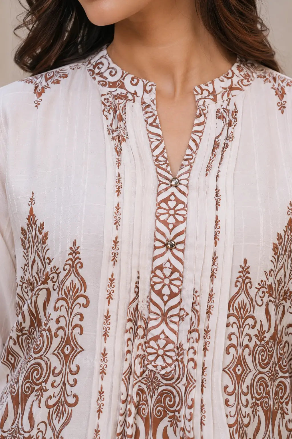 Close up neck design of Rabric cotton kurta featuring detailed brown ethnic floral print mandarin neckline and premium stitching
