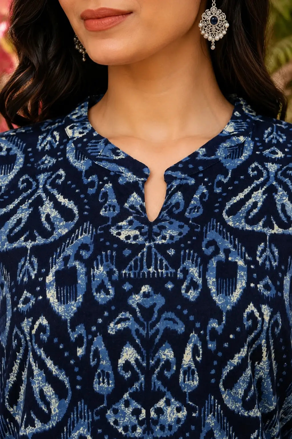 Closeup of stylish V neck design on Rabric blue cotton printed women kurti with premium ethnic detailing
