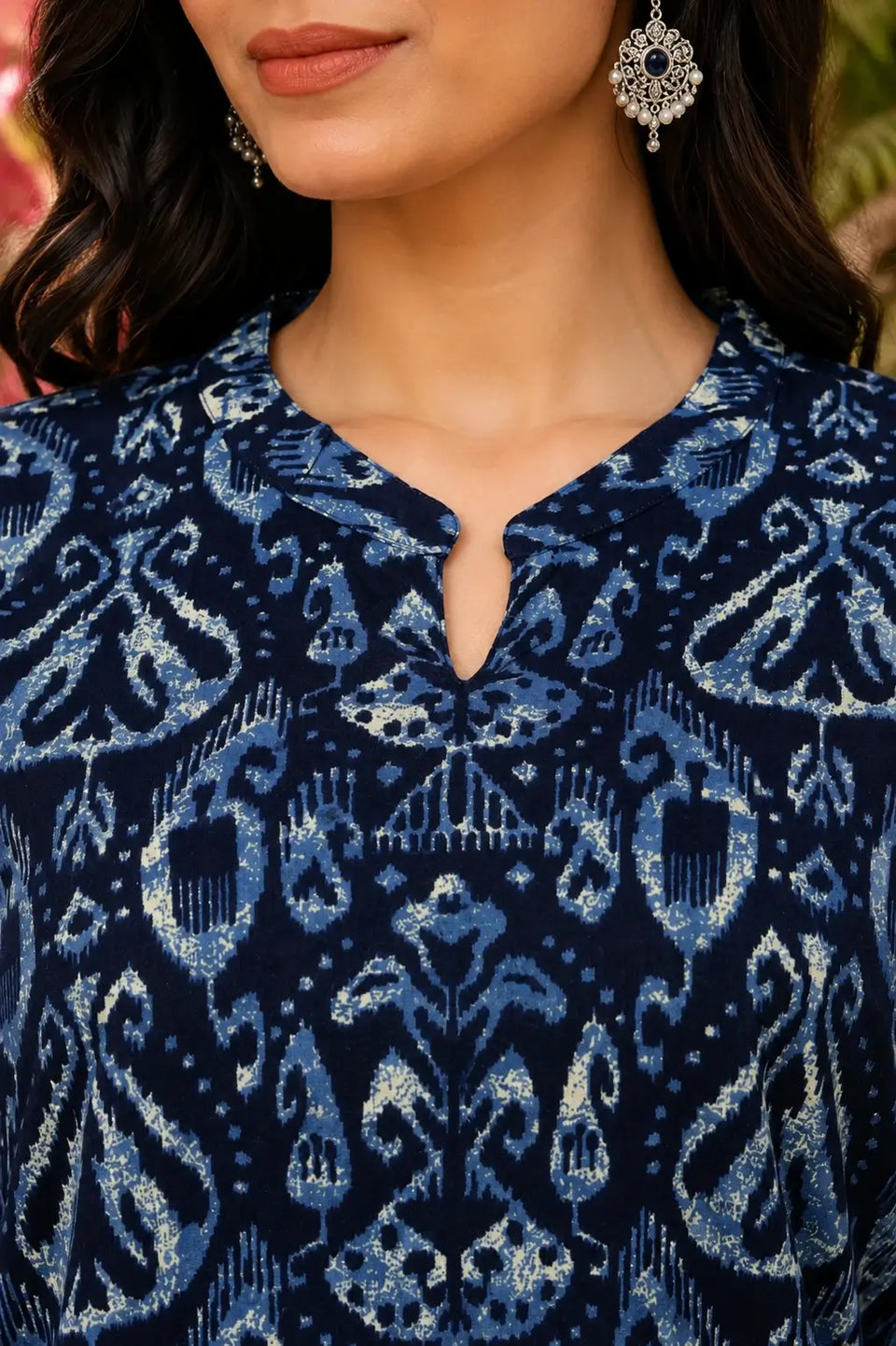Closeup of stylish V neck design on Rabric blue cotton printed women kurti with premium ethnic detailing