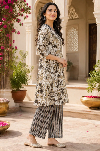 Side angle view of Rabric women cotton printed kurta palazzo set in beige and brown floral design ethnic wear