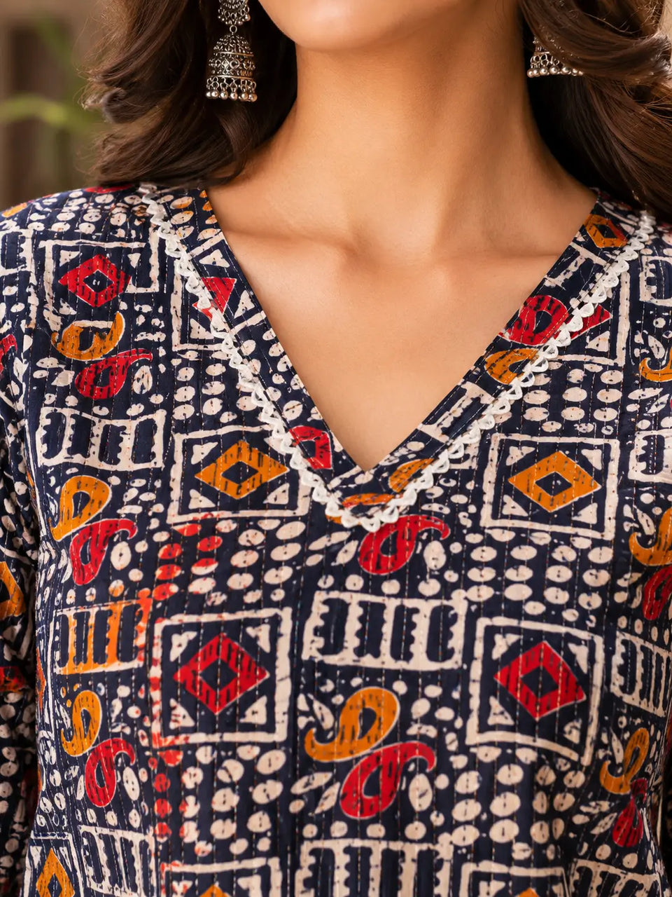 Closeup of stylish V neck design on Rabric navy blue cotton printed kurti for women casual ethnic fashion