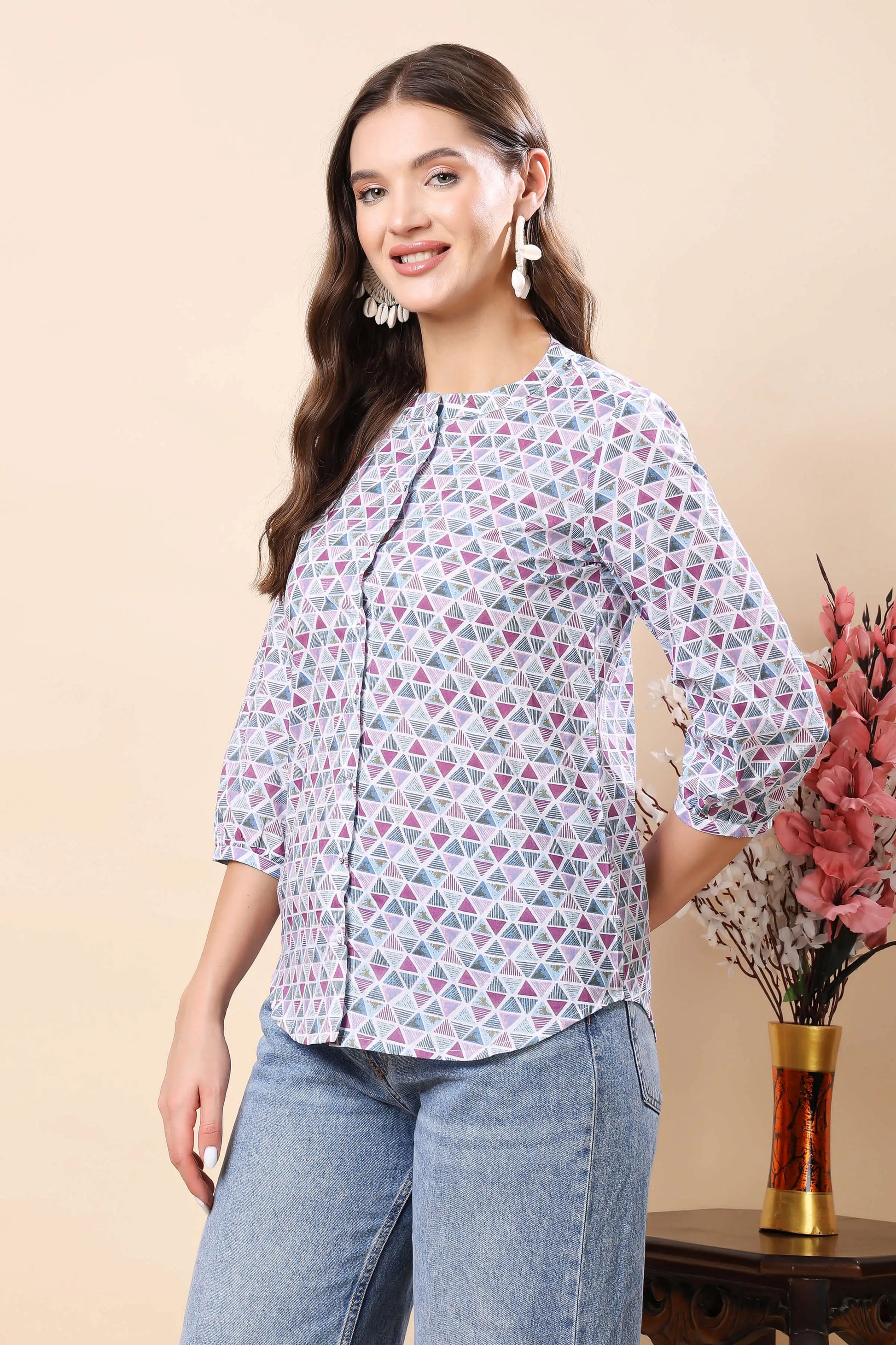 Side view of women’s geometric print button-down shirt