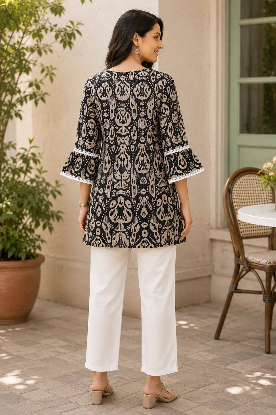 Back view of Rabric women cotton printed short kurti with layered bell sleeves and stylish straight fit design
