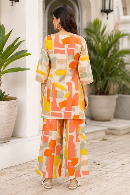 Back view of Rabric cream beige cotton co-ord set for women featuring coral peach orange yellow and sage green abstract geometric print design