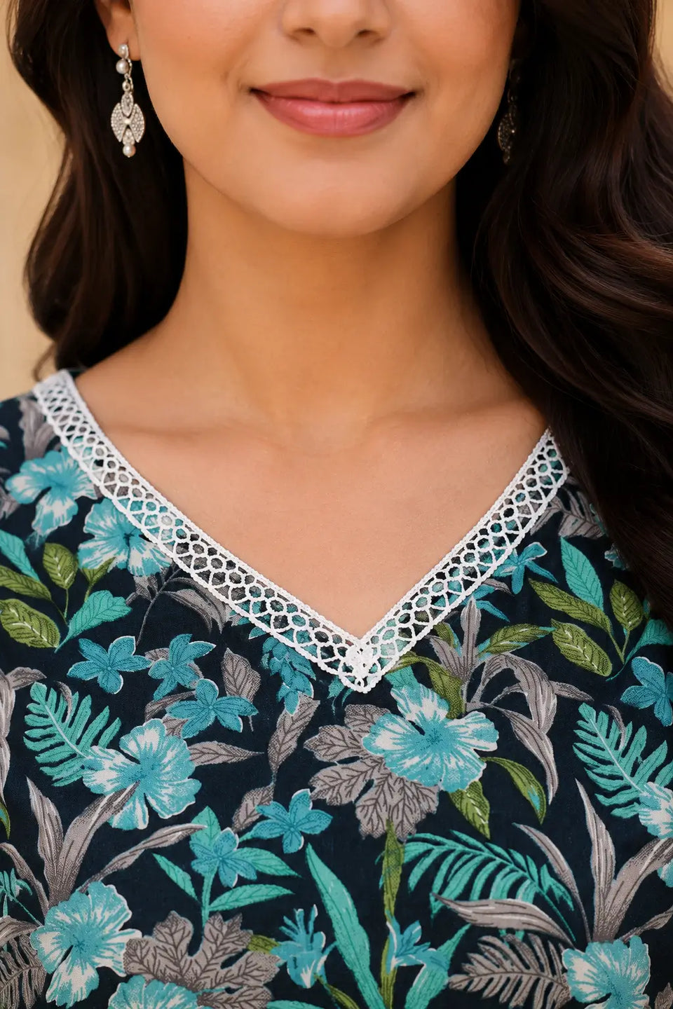 Close up of Rabric dark navy cotton kurta set V neck white lace design with teal floral print, elegant neck pattern for women