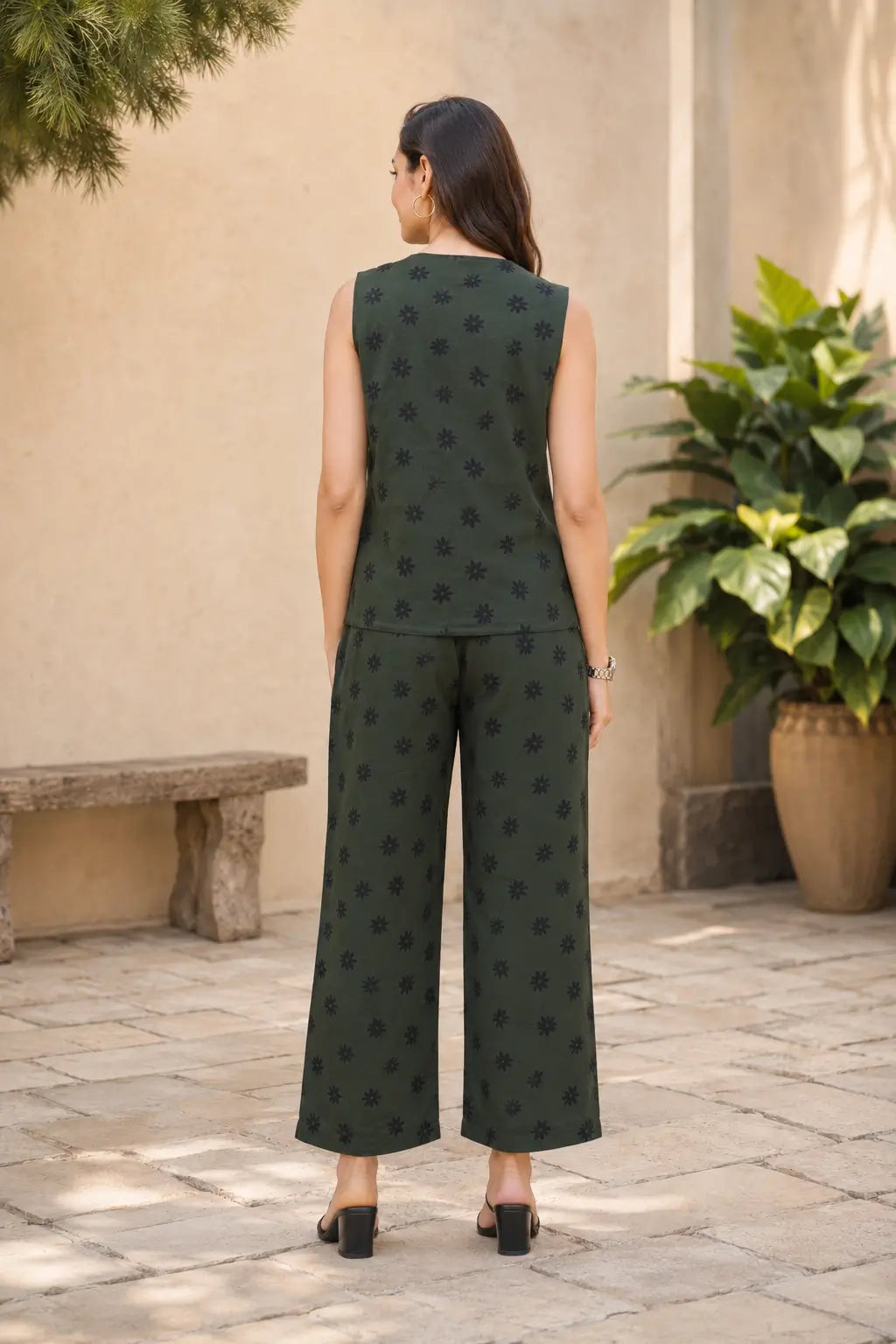 Back view of Rabric dark olive green cotton floral printed co-ord set for women featuring sleeveless short top and matching wide leg pajama