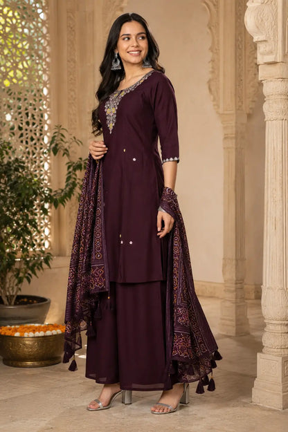 Side view of dark plum cotton kurta palazzo set with dupatta by Rabric featuring flared silhouette and designer sleeves
