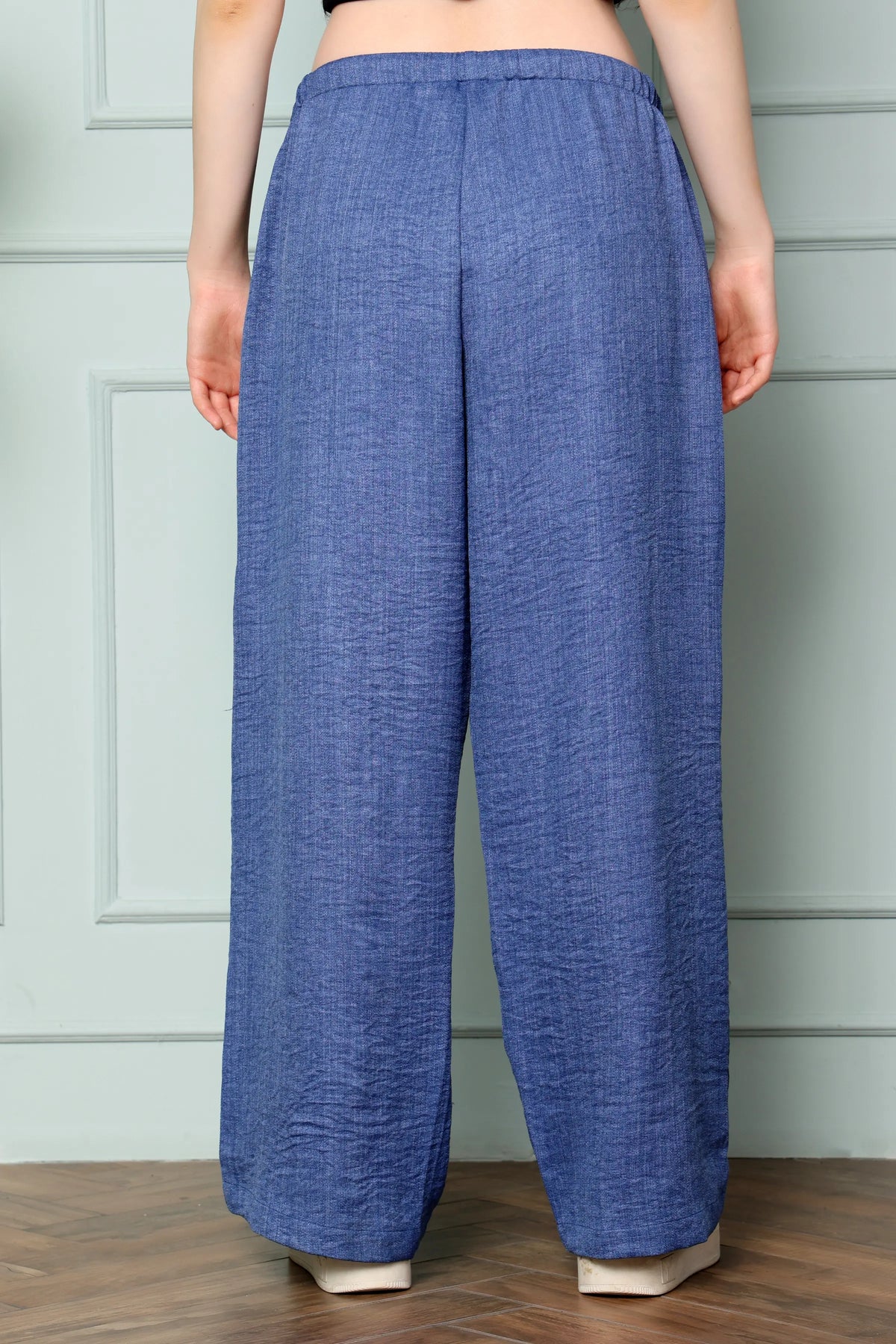 RABRIC Denim Blue linen women trousers back view in relaxed wide leg fit