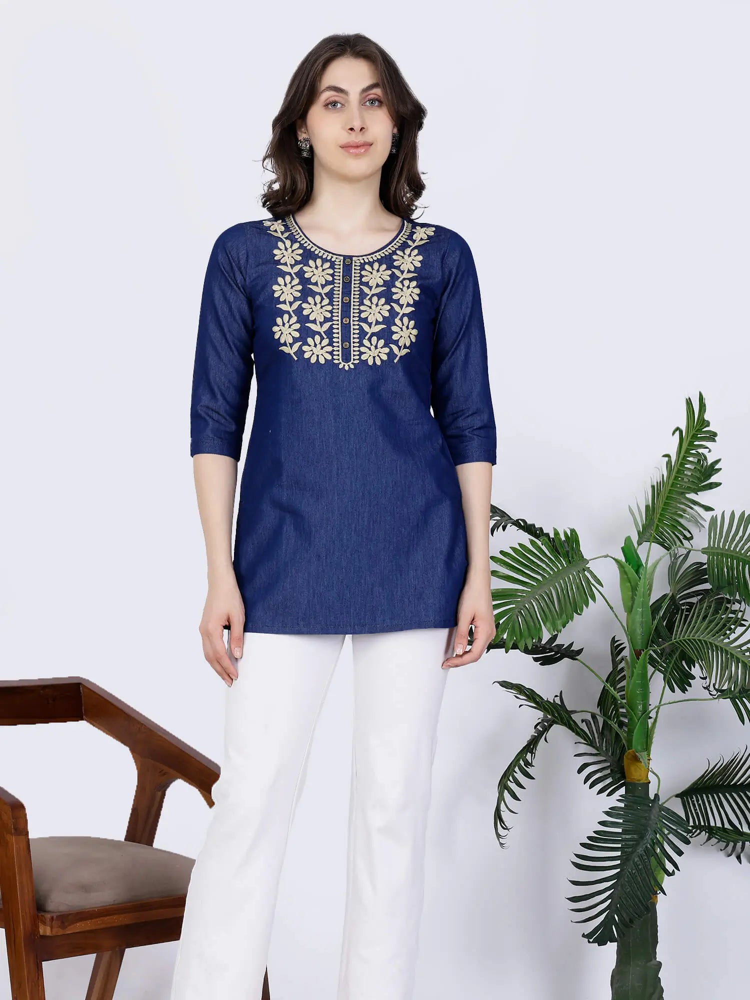 Model wearing Rabric embroidered denim short kurti for casual wear