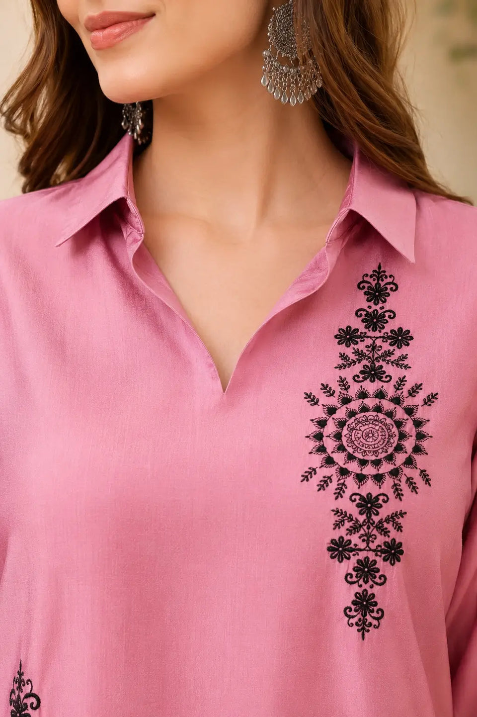 Close-up of collared V-neck design on dusty pink Vertican Silk women's co-ord set with intricate black floral embroidery.