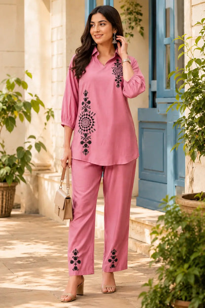 Woman wearing dusty pink Vertican Silk embroidered co-ord set outdoors, perfect for summer casual wear, travel and brunch outfits.