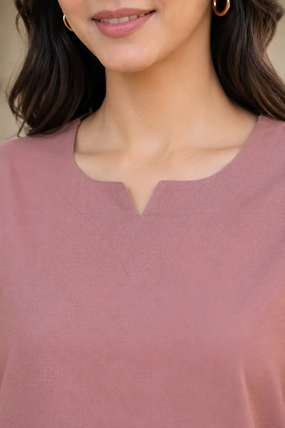 Close up of Rabric dusty rose cotton co-ord set for women showing notch neck design, plain solid fabric texture and neat stitching