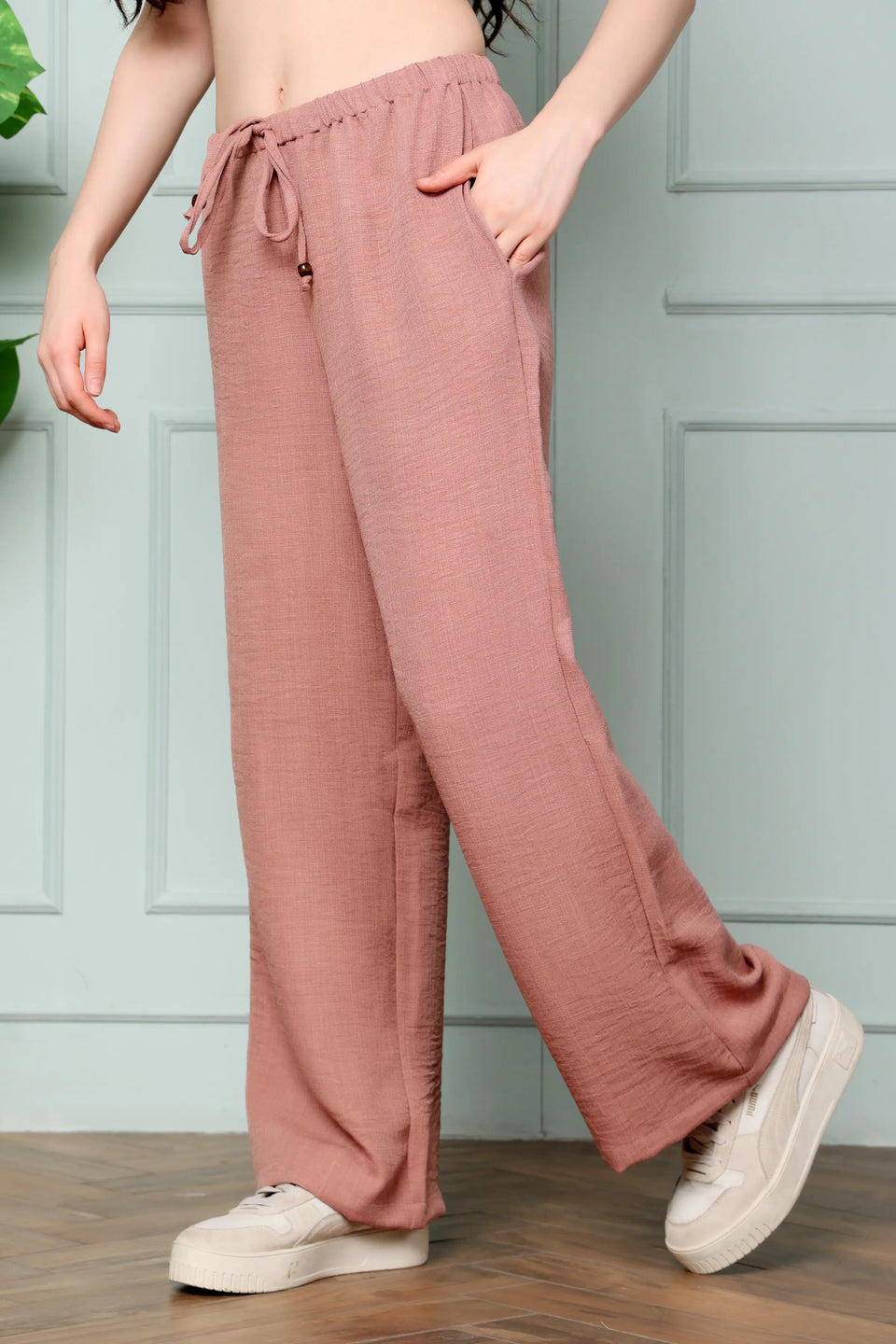 RABRIC dusty rose linen trousers for women side view highlighting functional pocket and wide leg fit